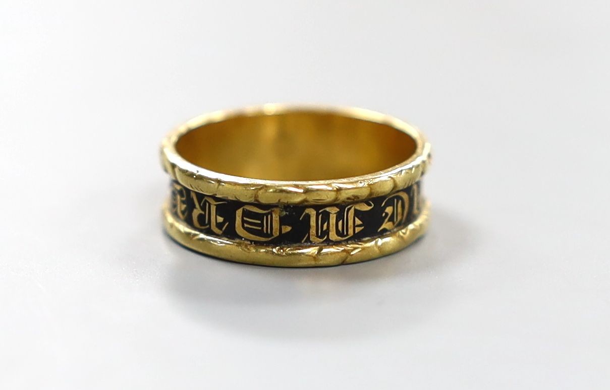 A late George IV 18ct gold and black enamel set mourning band, inscribed 'In Memory Of', shank hallmarked for Birmingham, 1829, size K/L, gross weight 3.2 grams.